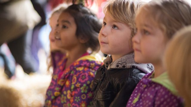 A group of children standing in a row